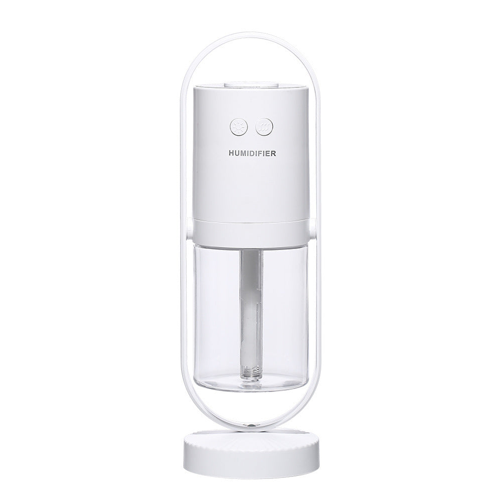 White USB Mini Humidifier with minimalist design and clear water tank, suitable for modern home or office decor.
