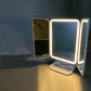 LED Vanity Makeup Mirror illuminated with warm light mode, showcasing its brightness and clarity for nighttime makeup use.