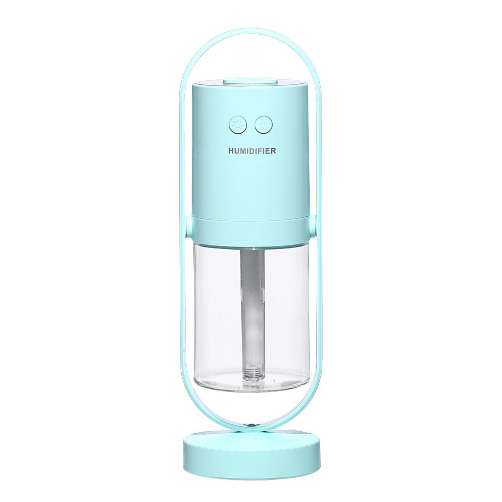 Light blue USB Mini Humidifier with clear water tank and modern design, ideal for small spaces needing air moisture.