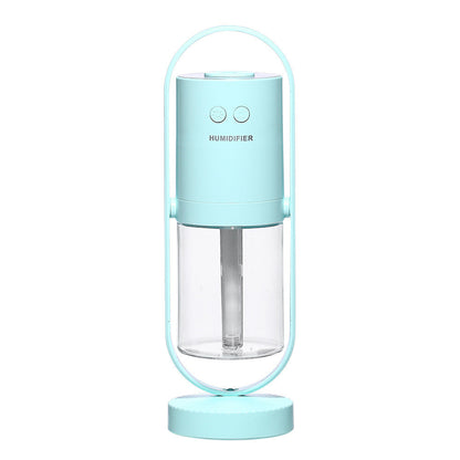 Light blue USB Mini Humidifier with clear water tank and modern design, ideal for small spaces needing air moisture.