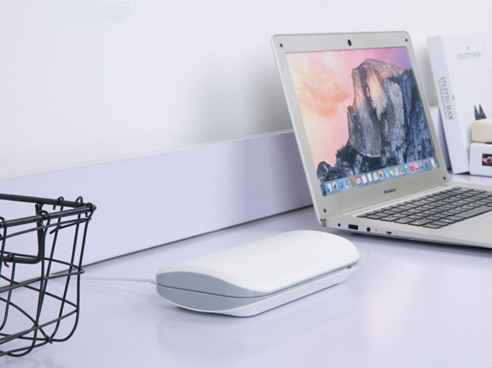 UV Phone Sanitizer Box connected via USB on desk beside laptop, compact and portable design uv phone sanitizer box end