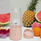 Portable USB Blender dash personal portable usb blender in pink with fruits like watermelon, pineapple, and oranges, ideal for on-the-go juicing.