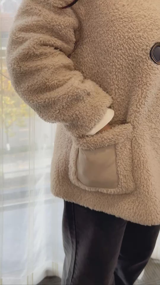 USB Rechargeable Hand Warmer tucked in coat pocket, demonstrating portability and convenience for hiking and camping.