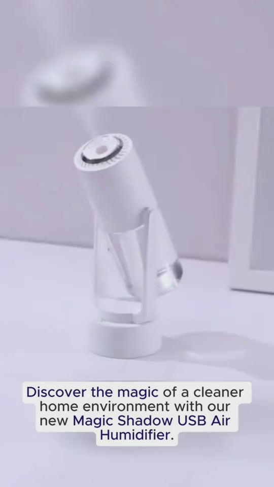 White USB Mini Humidifier tilted on desk with text promoting cleaner home air using Magic Shadow USB Air Humidifier.